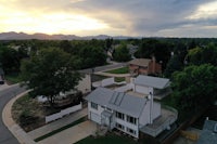 an aerial view of a house in a neighborhood