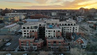 an aerial view of a city at sunset